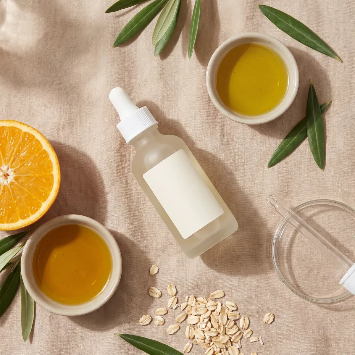 Fictional skincare serum arranged in an ingredient-led flat lay